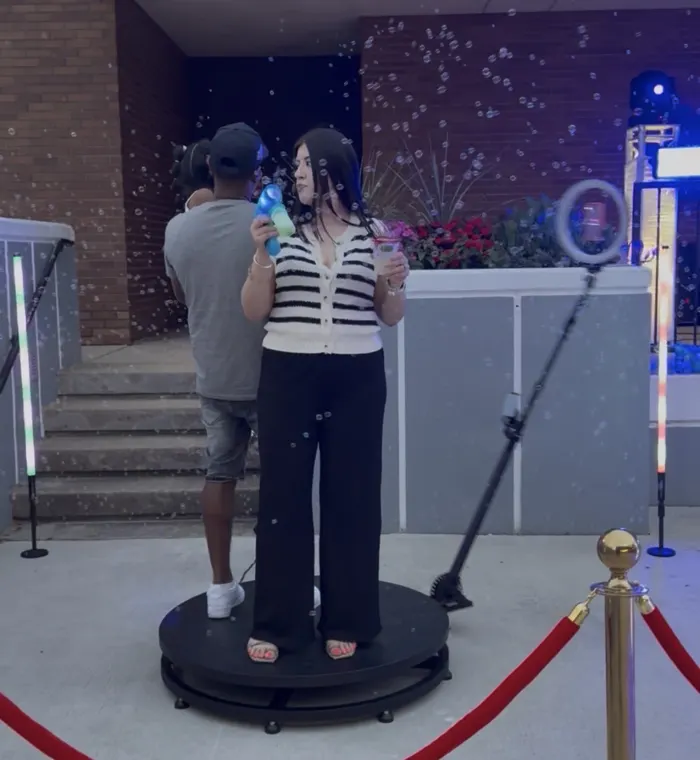 Guests enjoying the 360 booth with bubbles and LED lighting